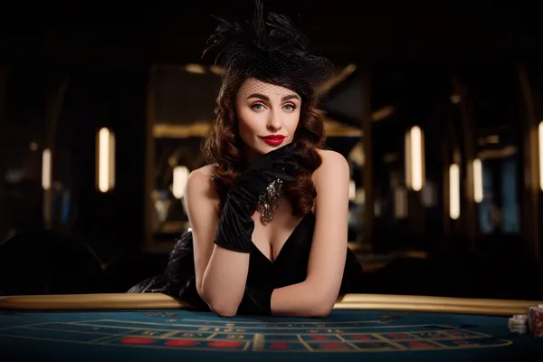 BAJI200 Casino — Step inside our high-end casino experience A glamorous woman holding casino chips in a neon-lit environment, representing the premium online casino atmosphere of BAJI200.